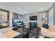 Bright and airy living room with a fireplace and views into other rooms at 10178 Nadine Ave, Parker, CO 80134