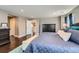 Large main bedroom boasts hardwood floors and a view into the hall at 10178 Nadine Ave, Parker, CO 80134