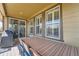 Covered outdoor patio area with a large dining table, chairs, and sliding glass door at 10178 Nadine Ave, Parker, CO 80134
