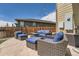 Back patio with outdoor furniture, offering a cozy space for relaxation and entertaining at 10178 Nadine Ave, Parker, CO 80134