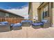 Backyard patio area with outdoor seating, decorative lighting, and a view of the backyard at 10178 Nadine Ave, Parker, CO 80134