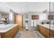 Spacious bathroom with dual vanities, modern fixtures, and ample storage at 1610 Little Raven St # 302, Denver, CO 80202