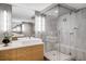 Contemporary bathroom with walk-in glass shower, modern vanity, and sleek design at 1610 Little Raven St # 302, Denver, CO 80202