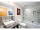 Stylish bathroom with a stainless sink, a bathtub and shower combination, and modern fixtures at 1610 Little Raven St # 302, Denver, CO 80202