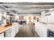 Open-concept living area combining kitchen, dining, and living spaces with plenty of light at 1610 Little Raven St # 302, Denver, CO 80202
