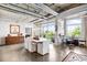 Bright living room featuring concrete floors, large windows offering views, and an open layout design at 1610 Little Raven St # 302, Denver, CO 80202