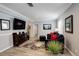 Finished basement featuring wood-look floors, a TV area, and comfortable seating for relaxation and entertainment at 8338 E 148Th Way, Thornton, CO 80602