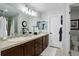 Bright bathroom features double sinks, a large mirror, and a separate toilet area for convenience at 8338 E 148Th Way, Thornton, CO 80602