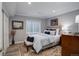 Comfortable bedroom with stylish decor, including a patterned rug and decorative pillows at 8338 E 148Th Way, Thornton, CO 80602