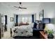 Bright bedroom with large windows, ceiling fan, and elegant furnishings, creating a relaxing atmosphere at 8338 E 148Th Way, Thornton, CO 80602