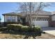Charming home with a well-maintained lawn, mature trees, and a two-car garage, enhancing curb appeal at 8338 E 148Th Way, Thornton, CO 80602