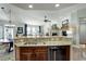 Open-concept kitchen with granite countertops, stainless steel appliances, and seamless flow to the living areas at 8338 E 148Th Way, Thornton, CO 80602