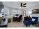 Well-appointed office with hardwood desk, comfortable blue chair, and golf decor at 8338 E 148Th Way, Thornton, CO 80602