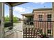 Cozy balcony view with metal railings, outdoor seating, and neighborhood scenery at 681 W Burgundy St # A, Highlands Ranch, CO 80129