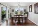 Charming dining room featuring a wooden table, seating for six, and sliding doors to the patio at 681 W Burgundy St # A, Highlands Ranch, CO 80129