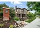 Attractive two-story townhome featuring brick exterior, manicured landscaping, and welcoming front entrance at 681 W Burgundy St # A, Highlands Ranch, CO 80129