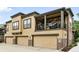 Attractive townhome featuring a balcony, 3-car garage, and a combination of siding and brick accents at 681 W Burgundy St # A, Highlands Ranch, CO 80129