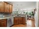 A kitchen area overlooks the dining room of this open-concept home at 681 W Burgundy St # A, Highlands Ranch, CO 80129