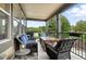 Cozy covered patio featuring comfortable seating, a stone fire pit, and views of the surrounding landscape at 681 W Burgundy St # A, Highlands Ranch, CO 80129
