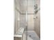 The bathroom features a tiled shower with a built-in seat and a glass door at 681 W Burgundy St # A, Highlands Ranch, CO 80129