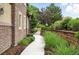 Brick walkway with landscaping that leads up to the home, creating a welcoming entrance at 681 W Burgundy St # A, Highlands Ranch, CO 80129
