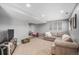 Finished basement featuring neutral walls, plush carpet, and a comfortable seating area at 3543 S Ceylon Way, Aurora, CO 80013