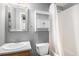 Bathroom with a white sink and toilet next to the shower and tub at 3543 S Ceylon Way, Aurora, CO 80013