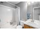 Bathroom with a bathtub and shower combination in gray tones at 3543 S Ceylon Way, Aurora, CO 80013