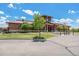 Community clubhouse featuring a well-manicured lawn and garden, offering a welcoming space for residents at 3543 S Ceylon Way, Aurora, CO 80013