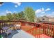 Cozy outdoor deck features wicker seating and a blue patterned rug, perfect for relaxing outdoors at 3543 S Ceylon Way, Aurora, CO 80013
