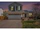 Charming two-story home with a well-manicured lawn, solar panels, and an attached two-car garage at 3543 S Ceylon Way, Aurora, CO 80013