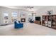 Bright living room featuring a cozy fireplace, plush furniture, and ample natural light at 3543 S Ceylon Way, Aurora, CO 80013