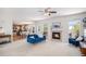 Inviting living room with fireplace, open to the dining area, showcasing a comfortable and connected living space at 3543 S Ceylon Way, Aurora, CO 80013