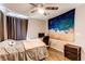 Comfortable bedroom with wood floors, a ceiling fan, and natural light from the window at 7087 Sapphire Pointe Blvd, Castle Rock, CO 80108