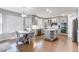 Bright eat-in kitchen features stainless appliances, a central island, and stylish light fixtures at 7087 Sapphire Pointe Blvd, Castle Rock, CO 80108