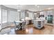 Bright eat-in kitchen features stainless appliances, a central island, and stylish light fixtures at 7087 Sapphire Pointe Blvd, Castle Rock, CO 80108
