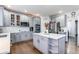 Modern kitchen featuring an island, stainless steel appliances, and plenty of cabinet space at 7087 Sapphire Pointe Blvd, Castle Rock, CO 80108