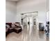 Spacious living room with high ceilings, hardwood floors, and a comfortable leather sectional sofa at 7087 Sapphire Pointe Blvd, Castle Rock, CO 80108