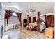 Spacious bedroom with a four-poster bed, vaulted ceiling, and modern ceiling fan at 7087 Sapphire Pointe Blvd, Castle Rock, CO 80108
