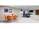 Finished basement with entertainment area, including a ping pong table and vibrant decor at 3901 S Dexter St, Cherry Hills Village, CO 80113