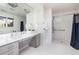 Clean bathroom featuring a large vanity, shower, and accessible design at 3901 S Dexter St, Cherry Hills Village, CO 80113