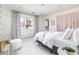 Charming bedroom with a cozy bed, decorative accents, and ample natural light at 3901 S Dexter St, Cherry Hills Village, CO 80113