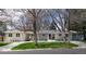 Stunning single story exterior featuring a well maintained lawn and mature trees in front at 3901 S Dexter St, Cherry Hills Village, CO 80113