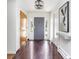 Inviting foyer featuring a gray front door, wood accents, and tile floors at 3901 S Dexter St, Cherry Hills Village, CO 80113