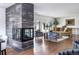 Large living room with fireplace, hardwood floors, stylish decor and furniture at 3901 S Dexter St, Cherry Hills Village, CO 80113
