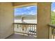View from a private balcony showing the building exterior and a parked vehicle at 1311 S Kingston St, Aurora, CO 80012