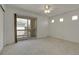 Bright bedroom featuring a sliding door leading to a private balcony and a ceiling fan at 1311 S Kingston St, Aurora, CO 80012