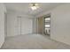 Spacious bedroom with carpet, a ceiling fan, a large closet, and sliding glass door access to a balcony at 1311 S Kingston St, Aurora, CO 80012