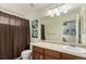 Clean bathroom featuring a vanity with a sink, alongside a toilet and shower, providing essential amenities at 7852 Solstice Way, Castle Rock, CO 80108