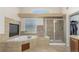 Luxurious bathroom featuring a soaking tub, a separate shower, and generous natural light at 7852 Solstice Way, Castle Rock, CO 80108